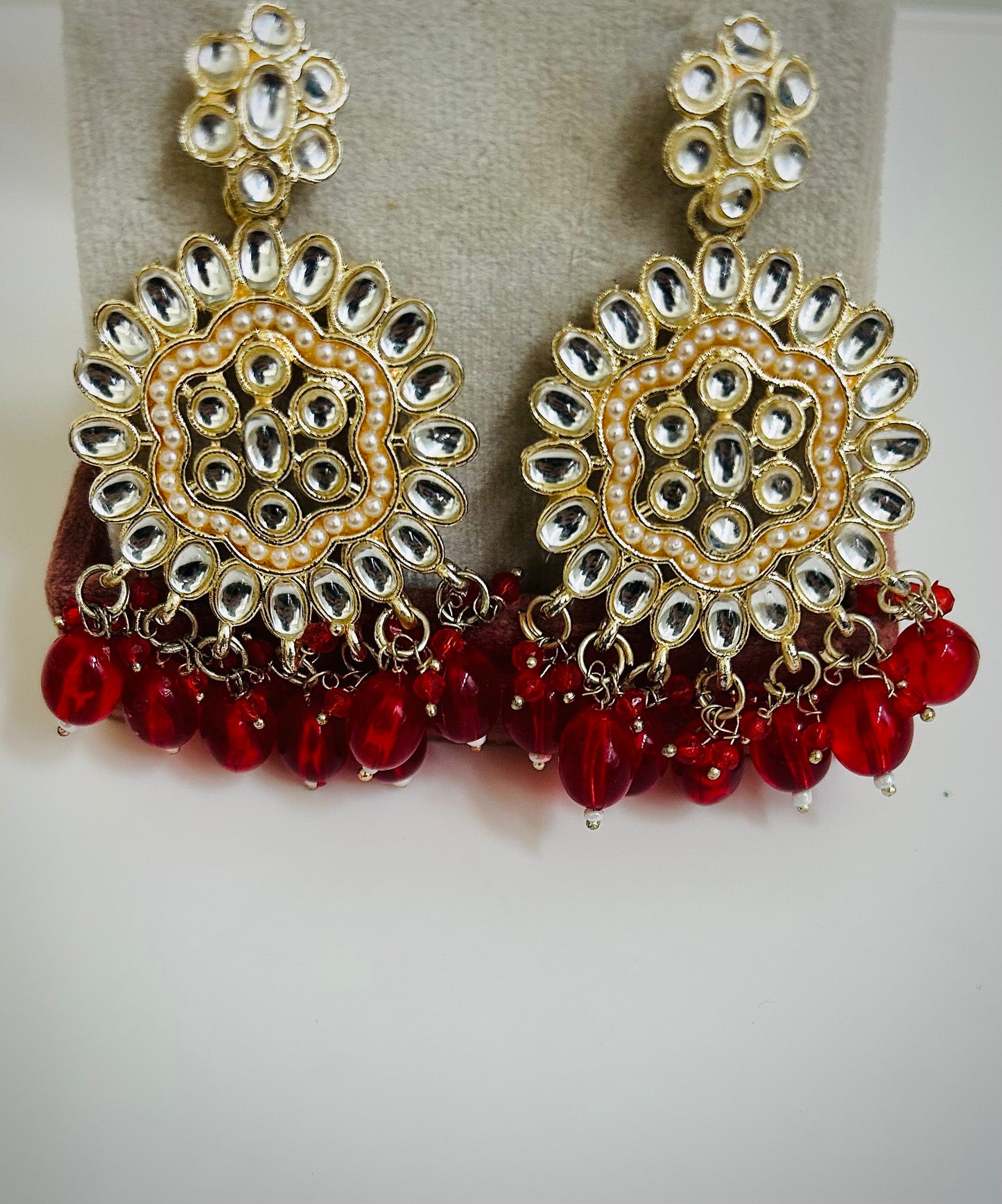 Traditional flat jhumka earrings in gold and silver tones with red accents – Desi festive jewelry