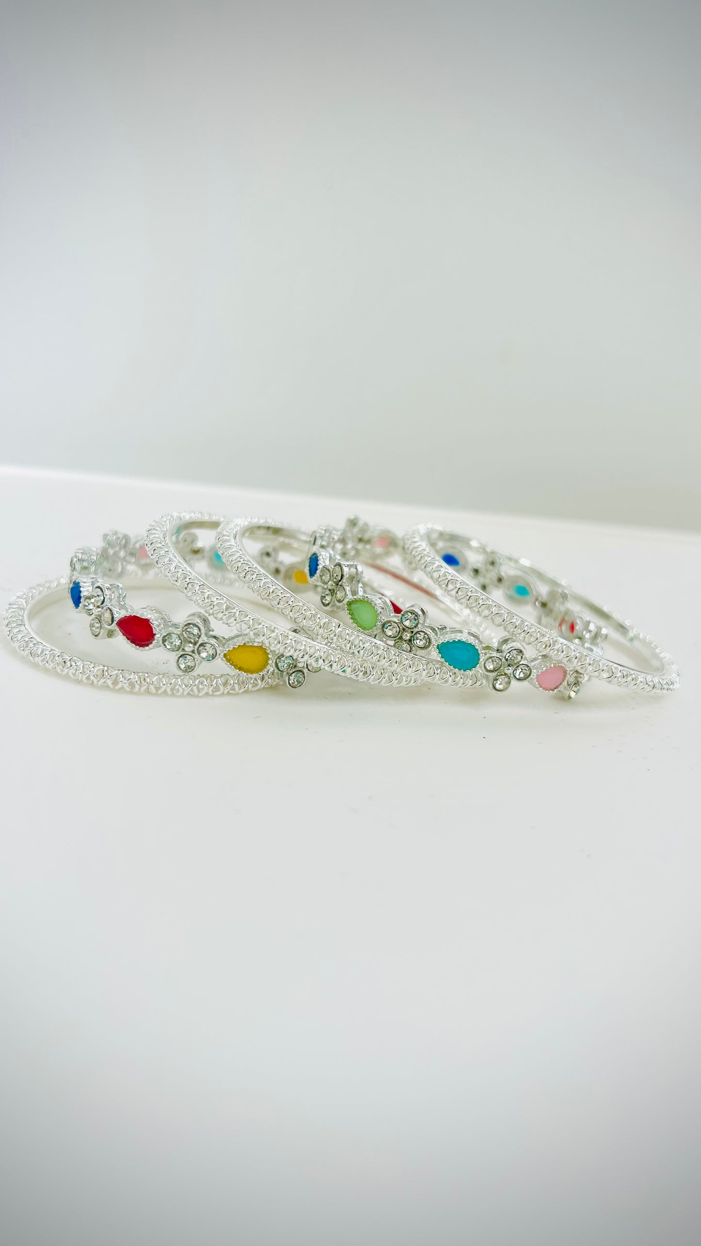 Kids' silver bangles with multicolored stones