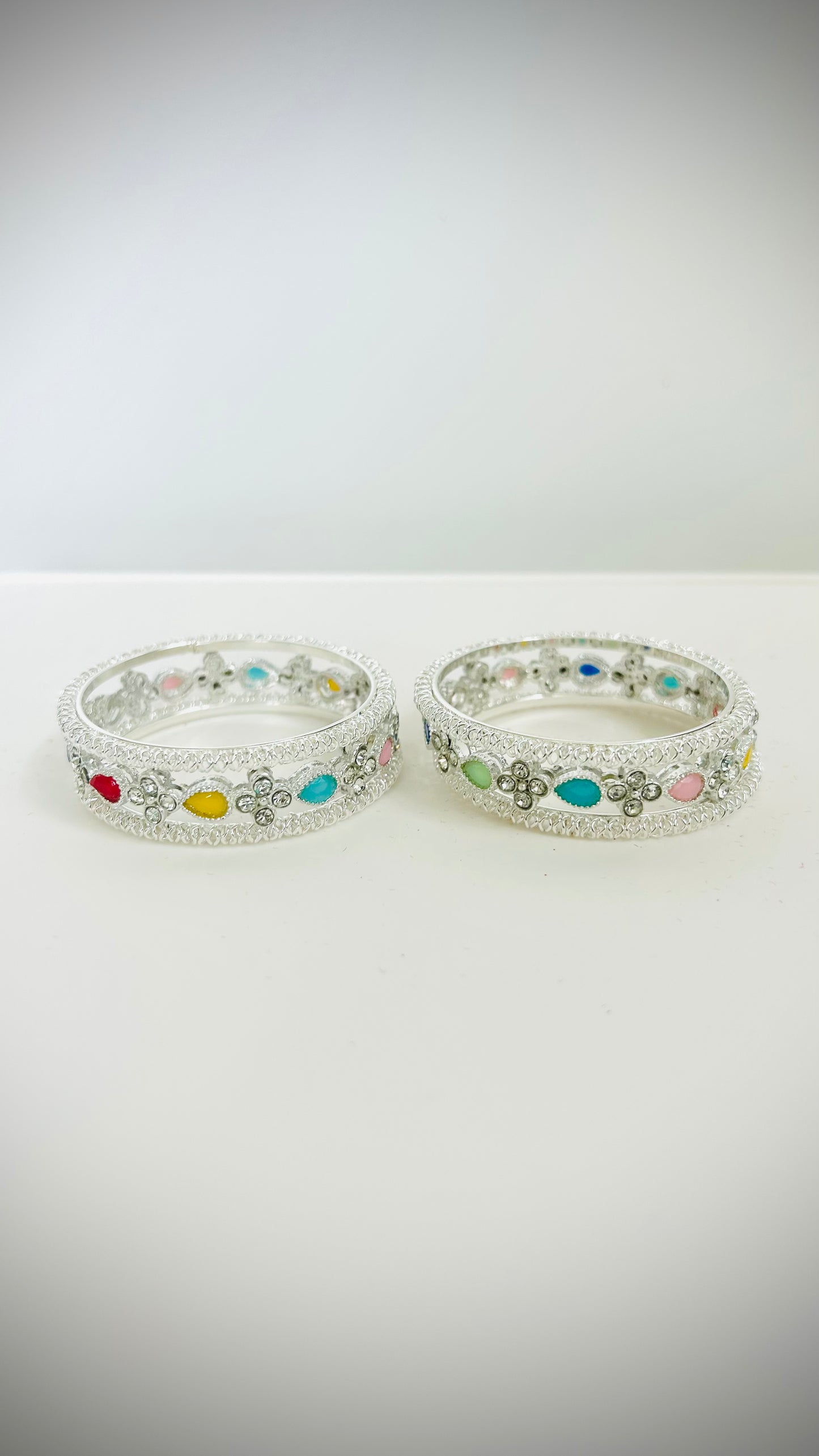 Kids' silver bangles with multicolored stones