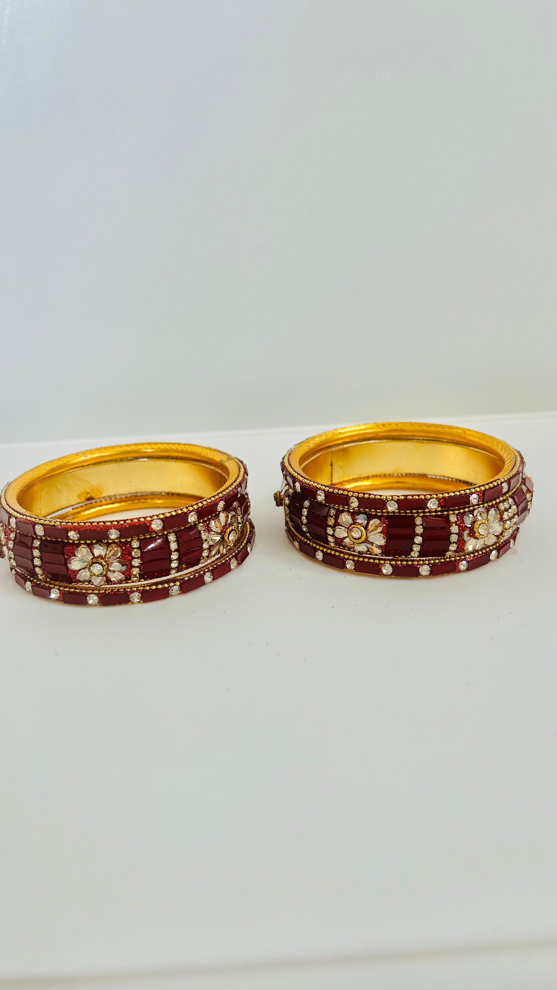 Set of gold and maroon bangles