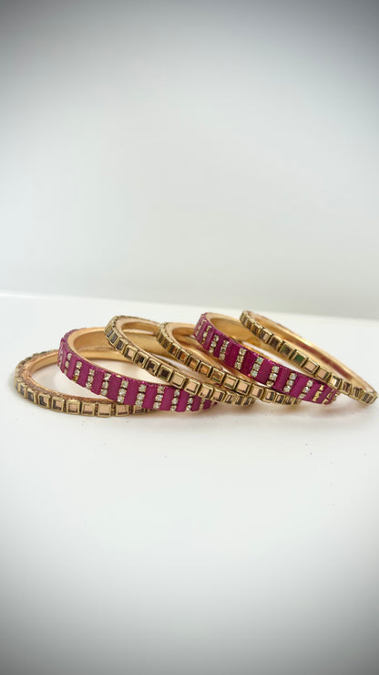 Set of 6 pink and gold desi bangles for children.