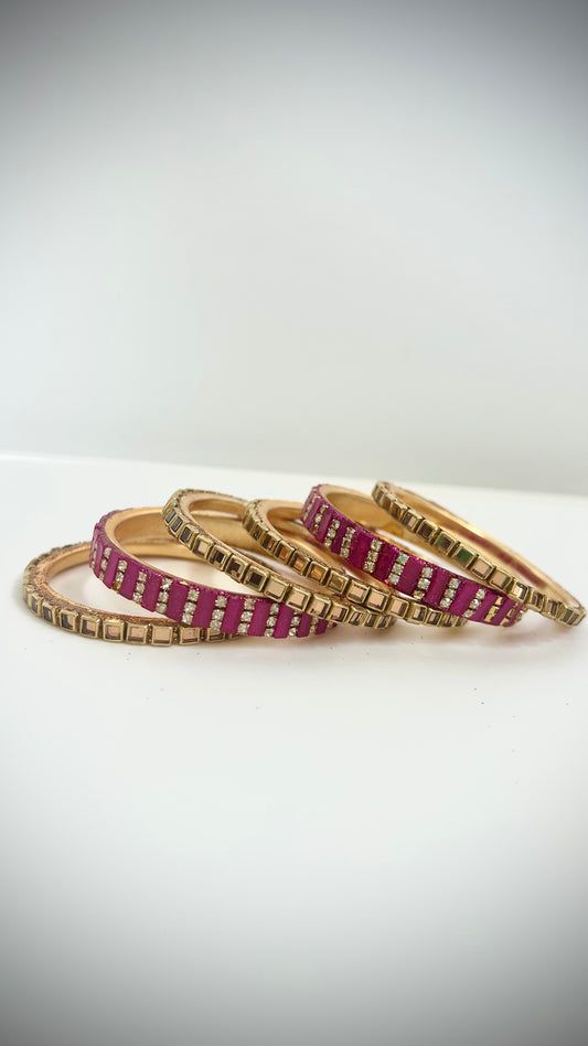 Set of 6 pink and gold desi bangles for children.