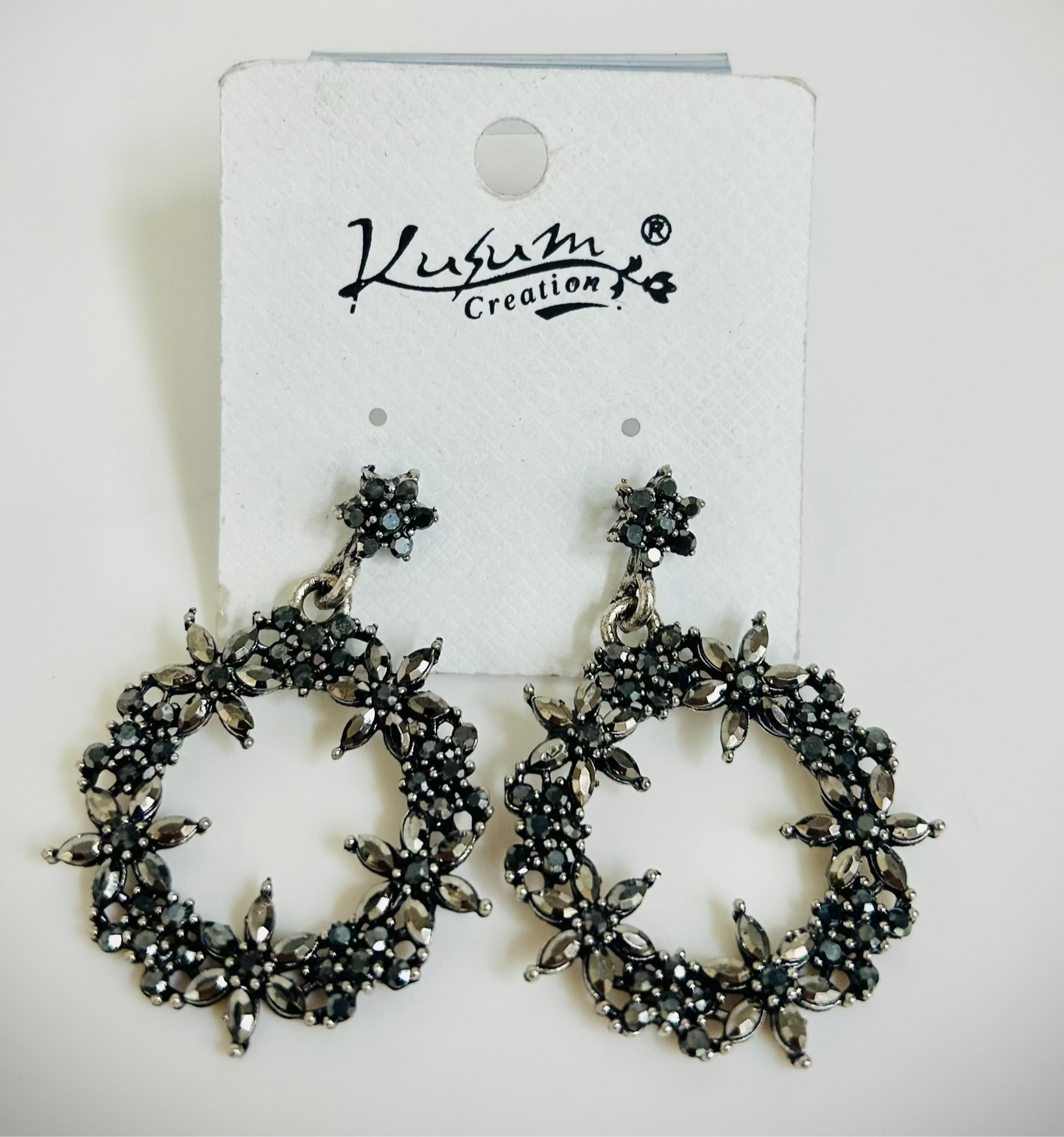 Silver-black metal hoop earrings with floral detailing – Indo-ethnic boho jewelry