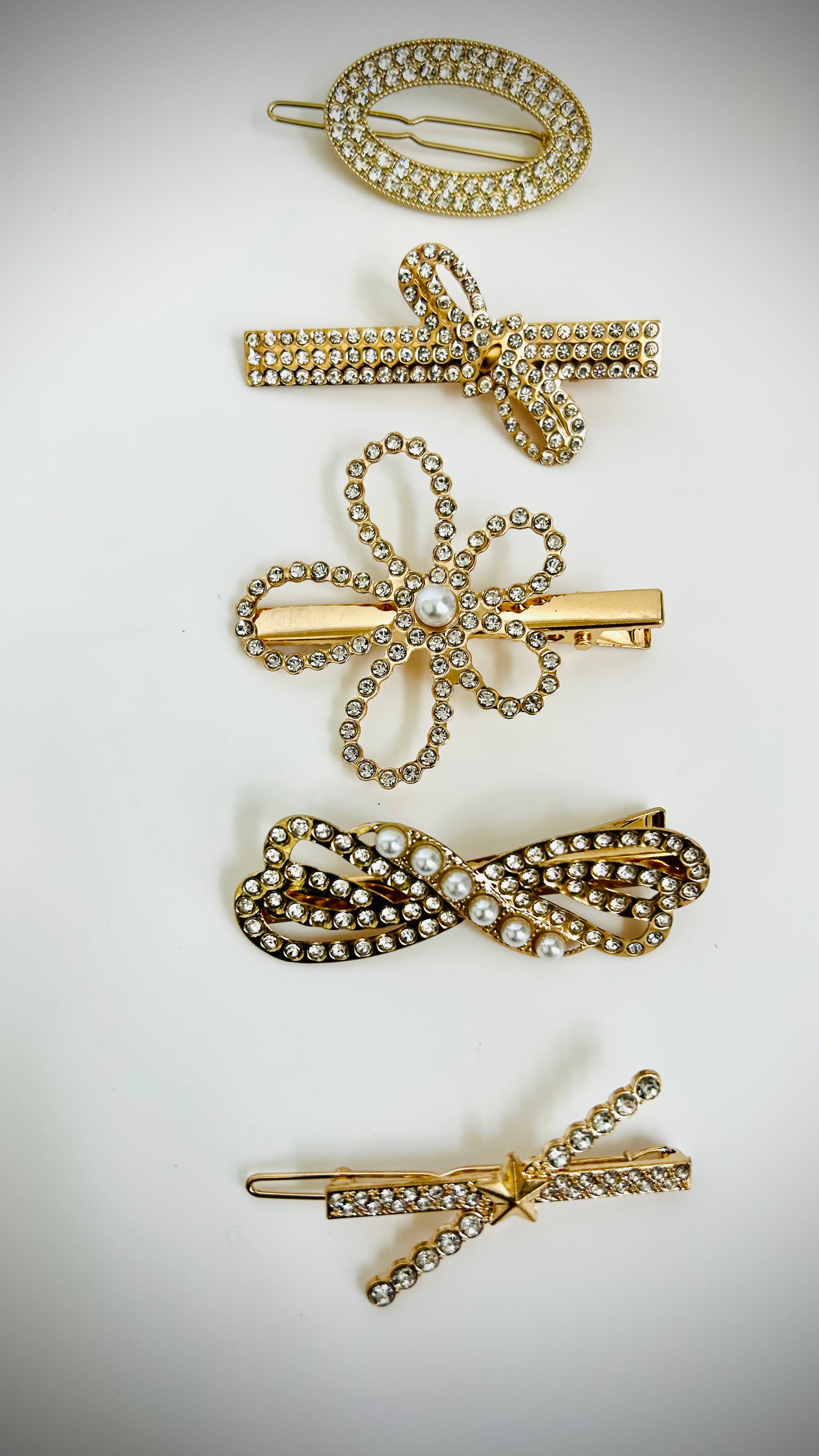 "Set of elegant gold hairclips with intricate designs for festive and daily wear"