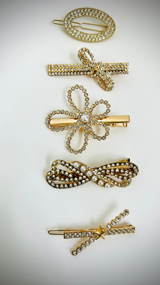 "Set of elegant gold hairclips with intricate designs for festive and daily wear"