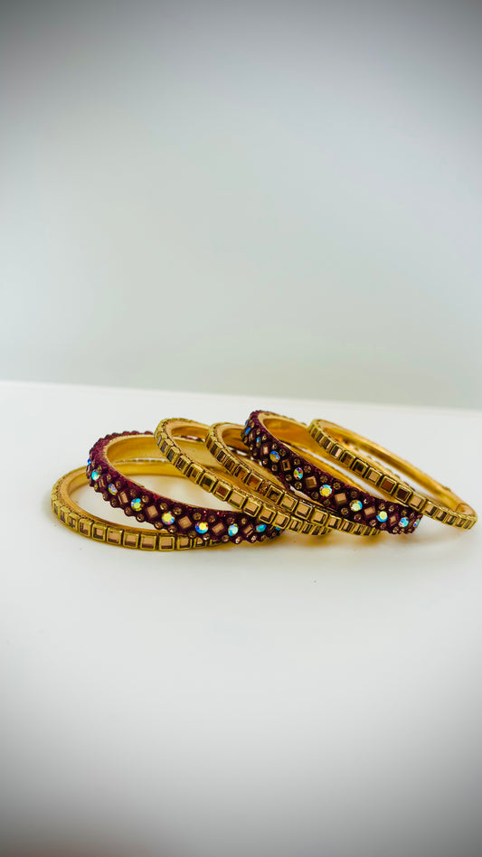 Set of gold and maroon bangles 