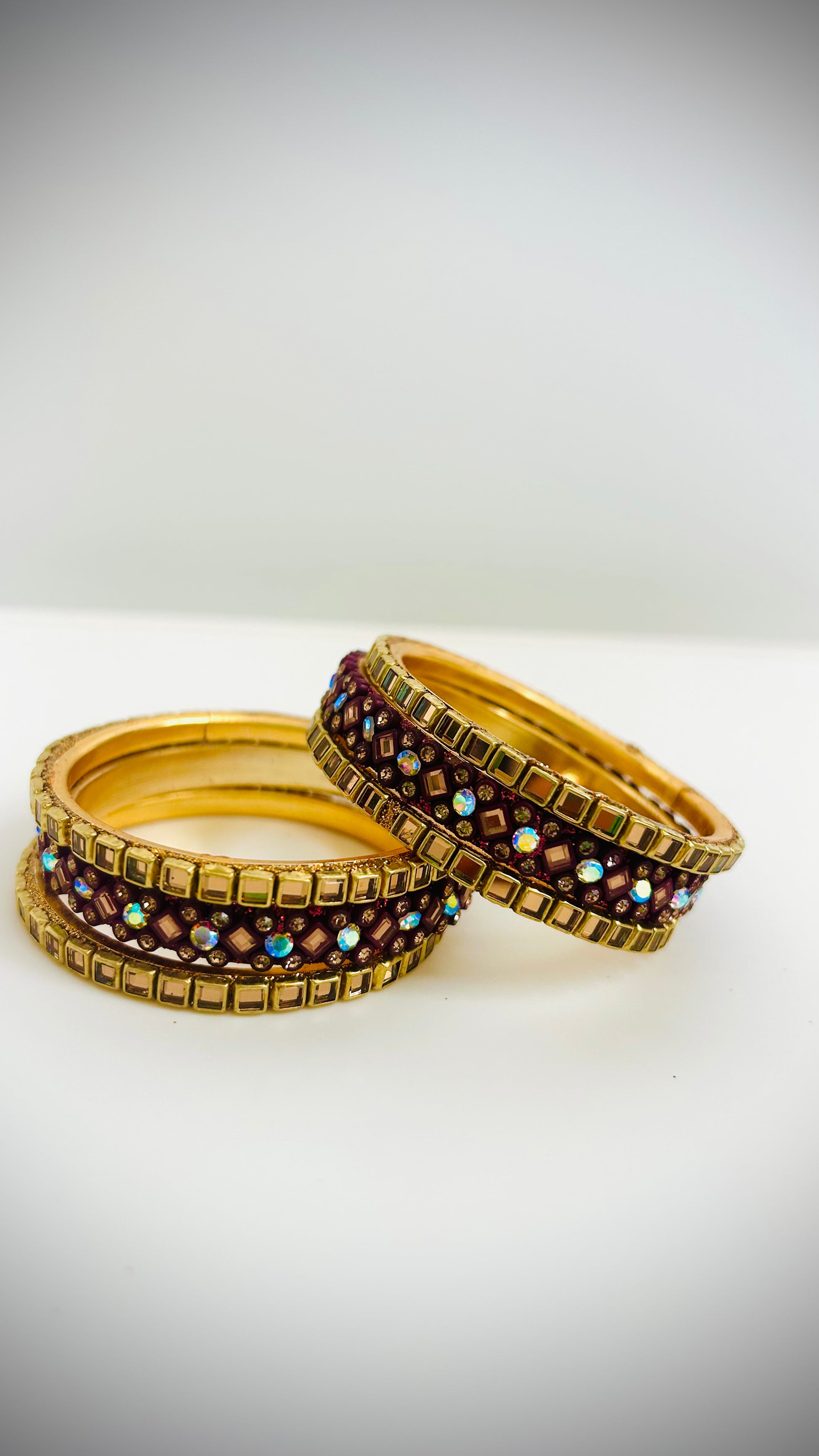 Set of gold and maroon bangles 