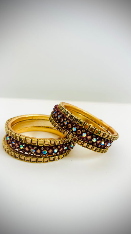 Set of gold and maroon bangles 