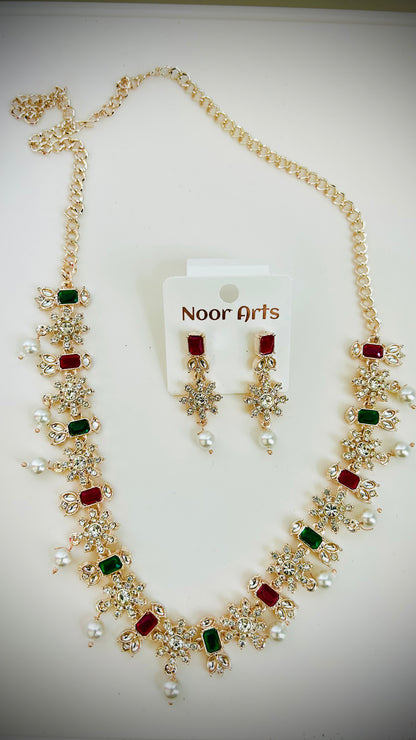 Jewelry set with necklace and earrings on a white background, branded 'Noor Arts'.