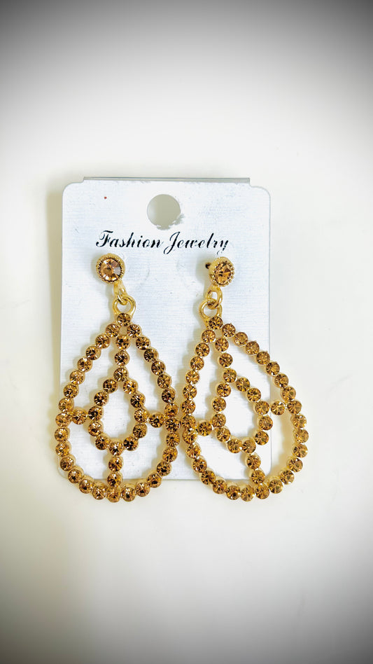 Gold teardrop earrings with intricate inner design – elegant and artistic ethnic jewelry