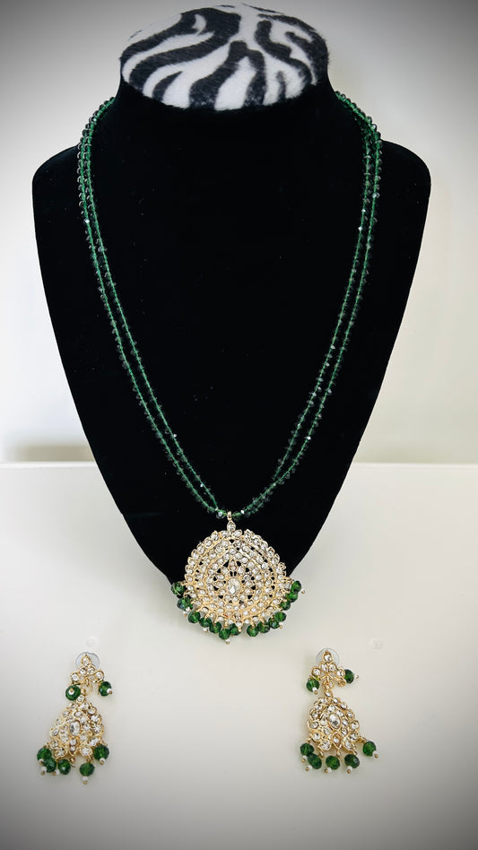 "Double-layer green beaded necklace with pendant and matching earrings"
