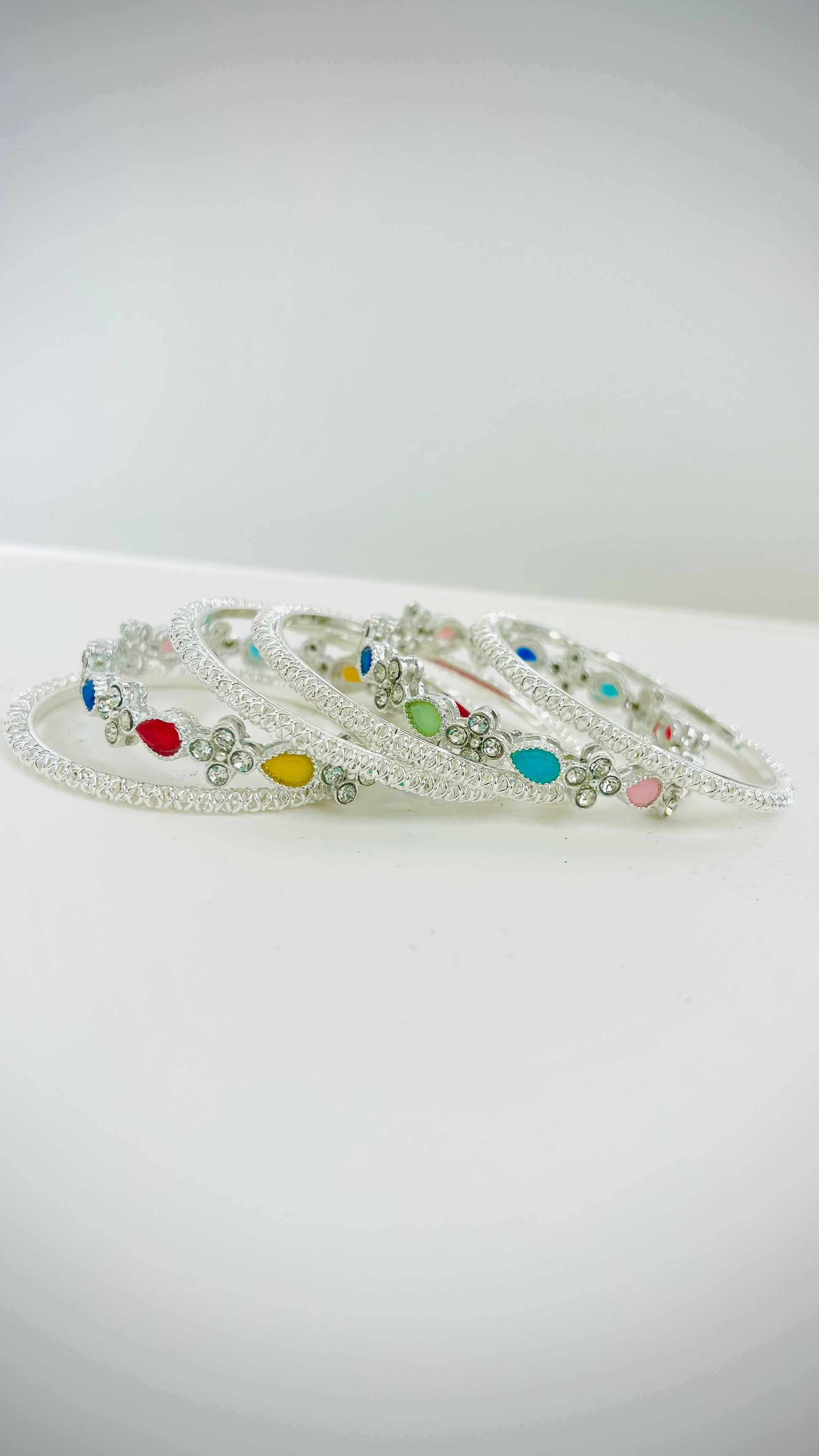 Kids' silver bangles with multicolored stones