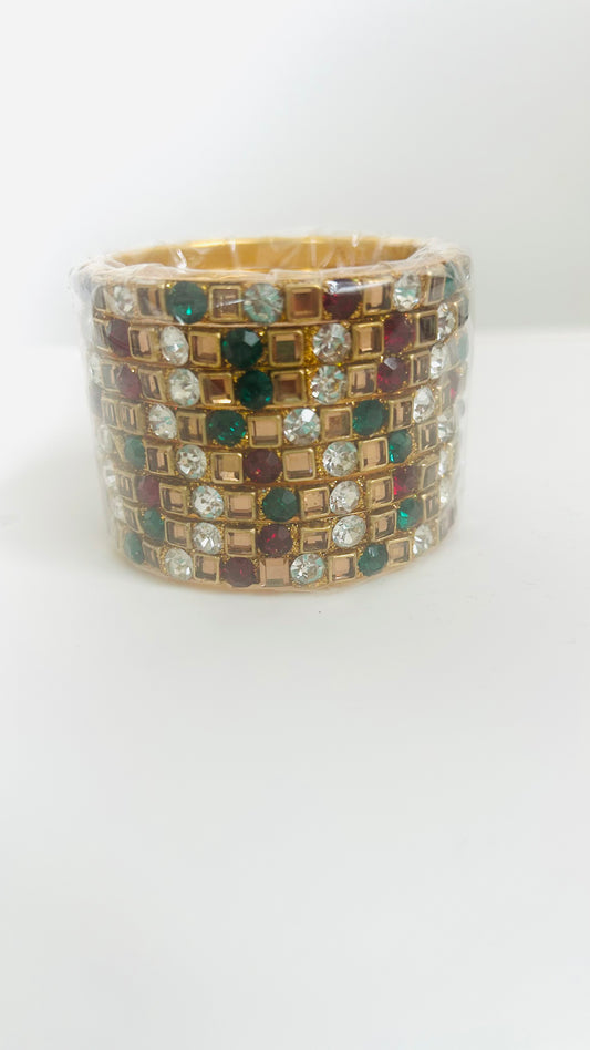 Multicolored gemstone bangles on a white background