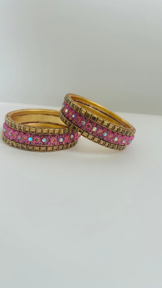 Set of gold and pink bangles 