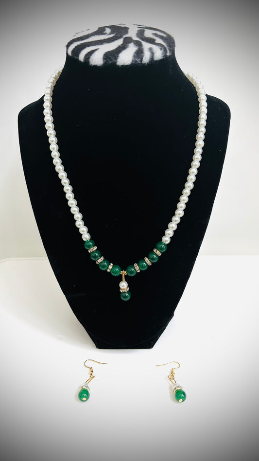Single-layer white pearl necklace with green pendant, green beads, and matching earrings – traditional Desi jewelry set