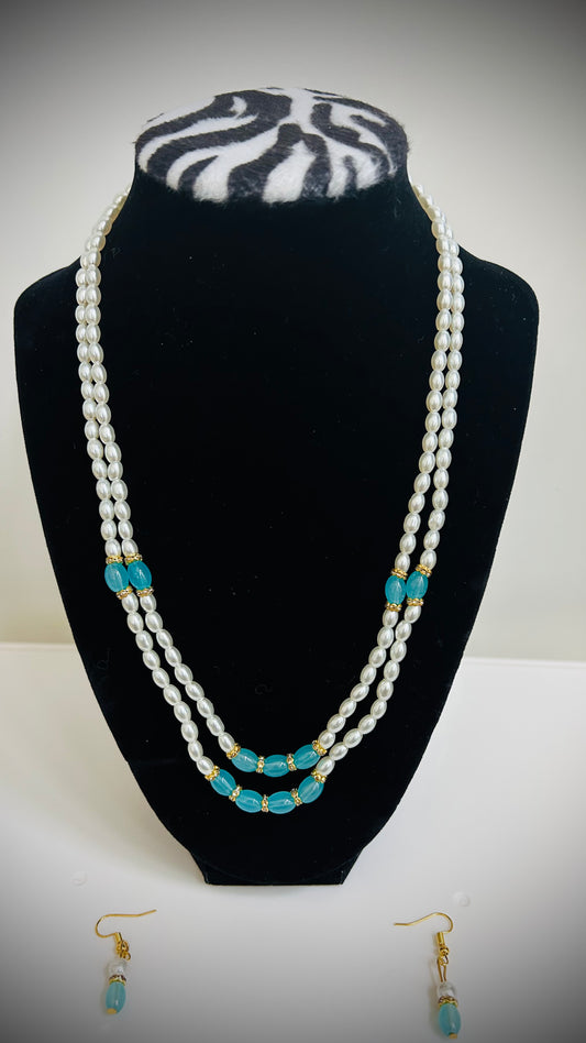 Double-layer white pearl necklace with teal bead accents and matching earrings – festive Desi jewelry set